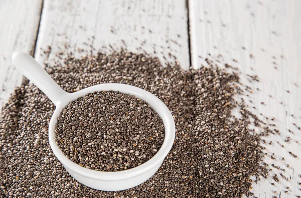 Superfood Chia seed on old wood background. — Stock Photo, Image