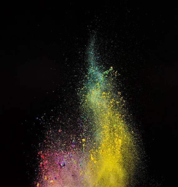 Farbige Pulverexplosion auf schwarzem Hintergrund. — Stockfoto