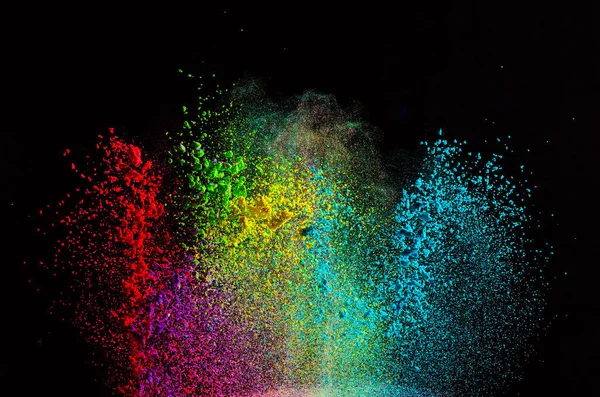 Explozie de pulbere colorată pe fundal negru . — Fotografie, imagine de stoc