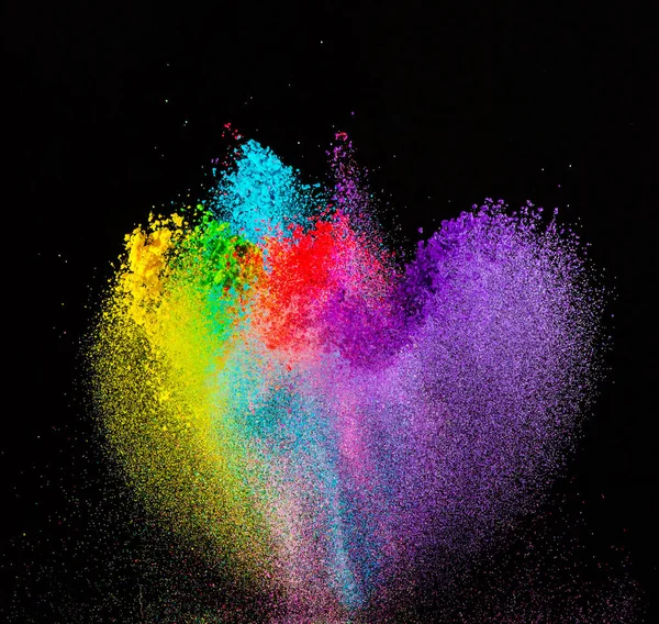 Colored powder explosion on black background.