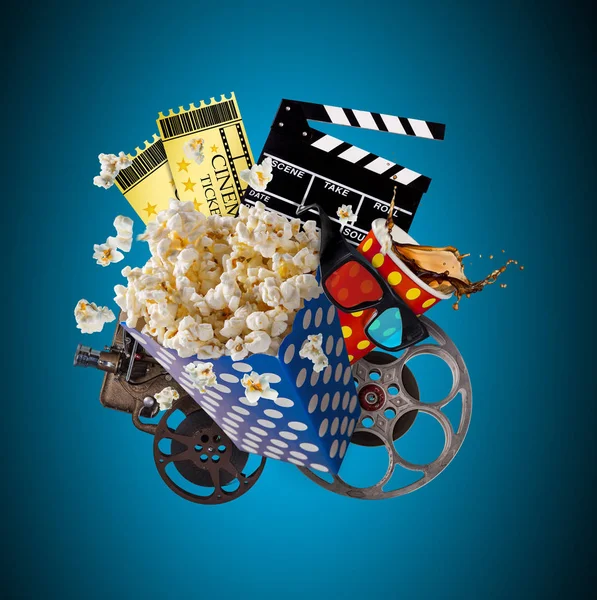 Pop-corn, movie tickets, clapperboard and other things in motion. — Stock Photo, Image