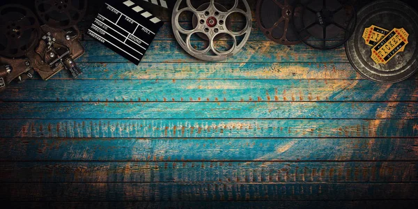 Cinema concept of vintage film reels, clapperboard and projector. — Stock Photo, Image