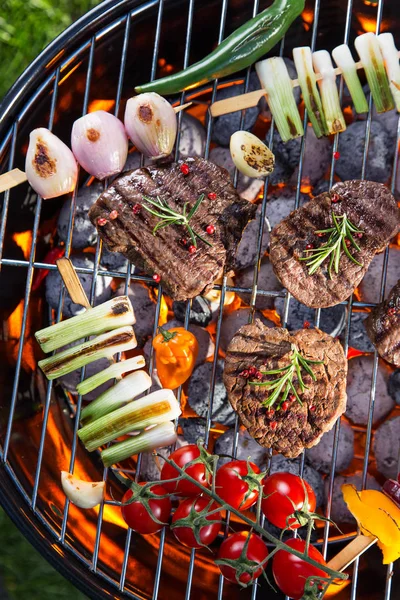 Barbecue grill with beef steaks, close-up. — Stock Photo, Image