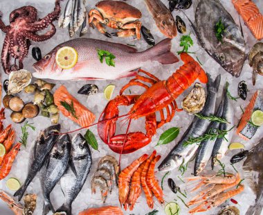 Fresh tasty seafood served on old wooden table. clipart