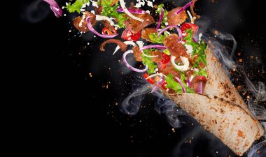 Kebab sandwich with flying ingredients. clipart