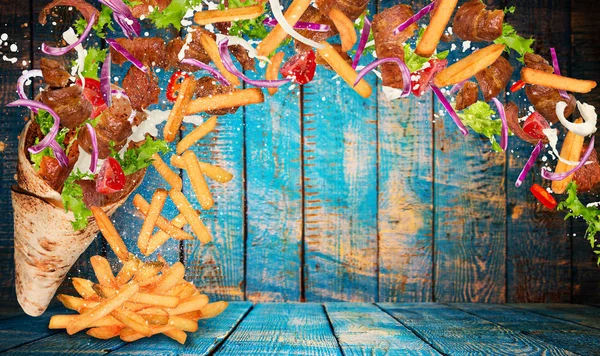 Kebab sandwich with flying ingredients. Royalty Free Stock Images