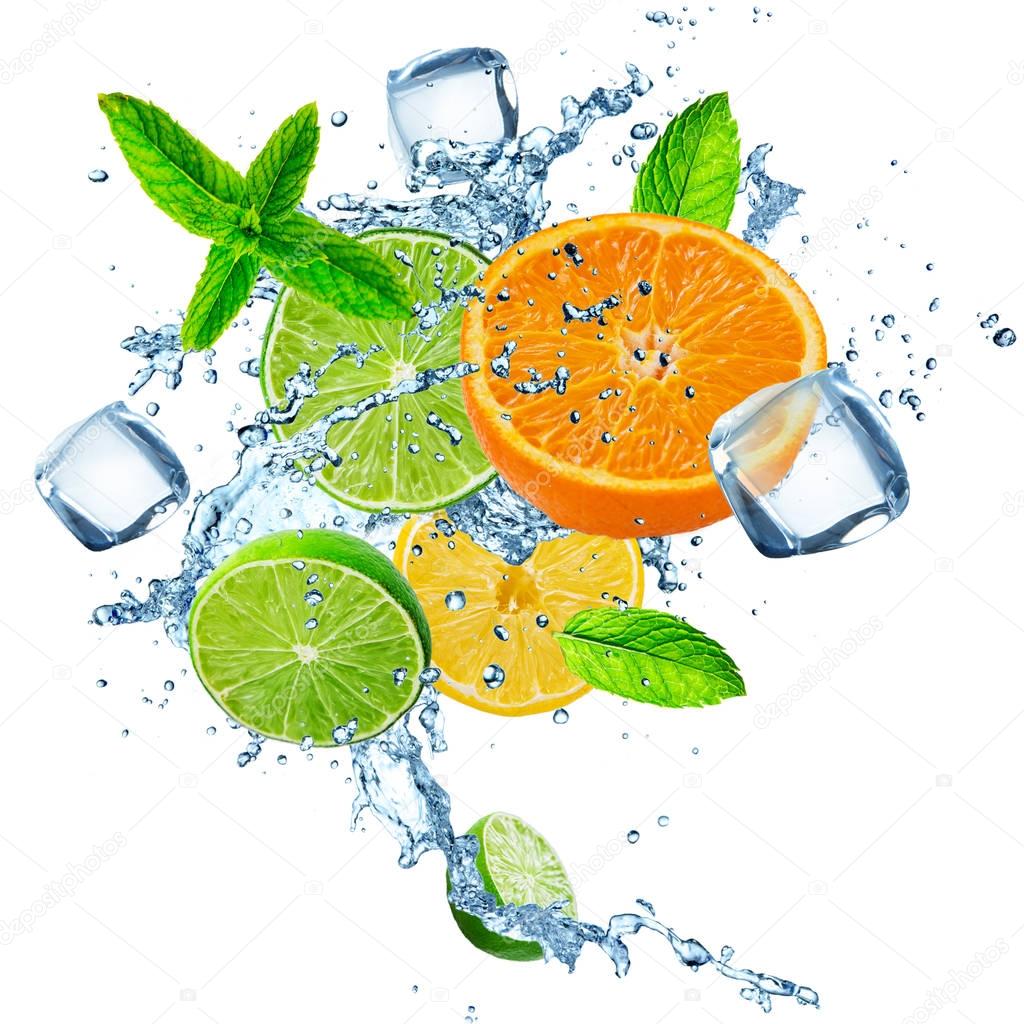 Fresh limes, oranges and lemons with water splash.