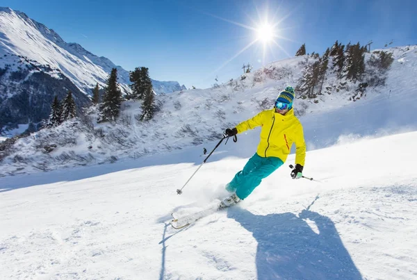 Skier skiing downhill in high mountains — Stock Photo, Image