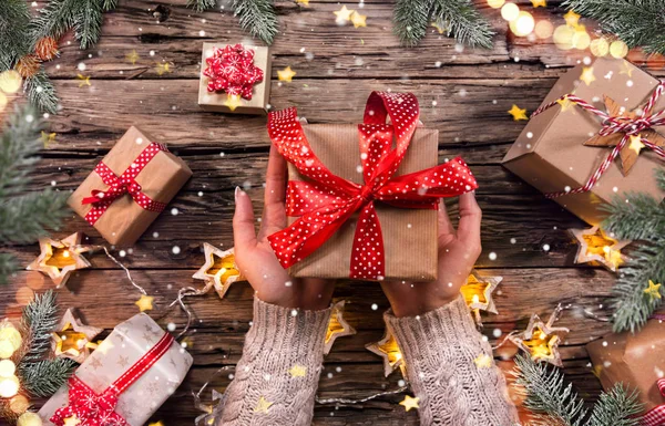 Top view of woman hands with gift box. — Stock Photo, Image