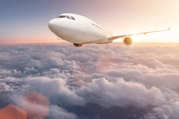 Commercial airplane flying above clouds. — Stock Photo, Image