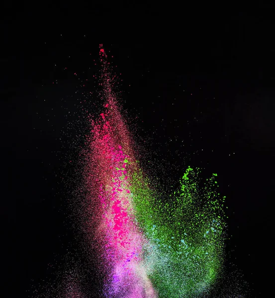 Запущений барвистий порошок, ізольований на чорному тлі — стокове фото