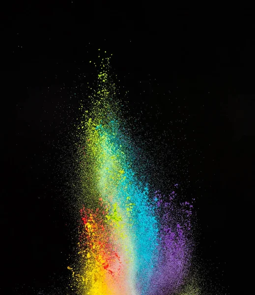 Launched colorful powder, isolated on black background — Stock Photo, Image