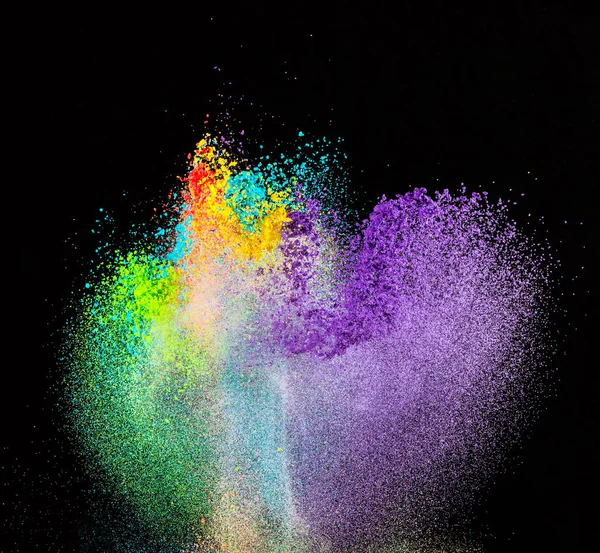 Launched colorful powder, isolated on black background — Stock Photo, Image