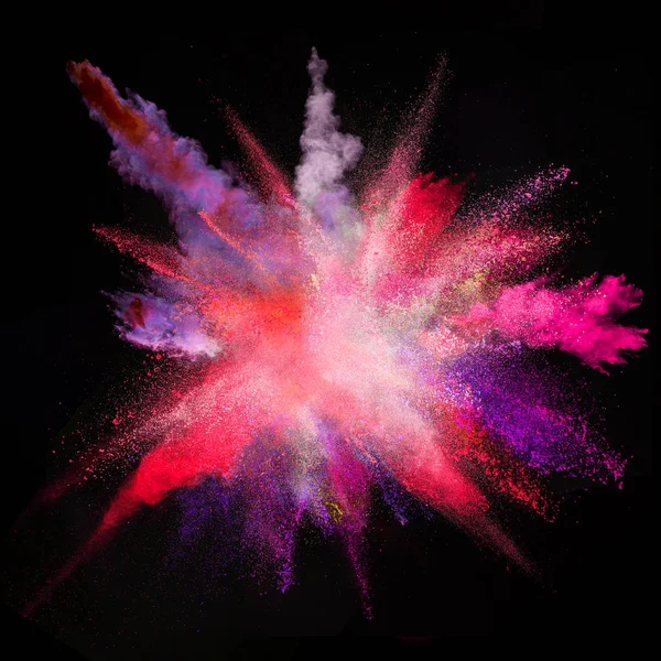 Colored powder explosion on black background. — Stock Photo, Image