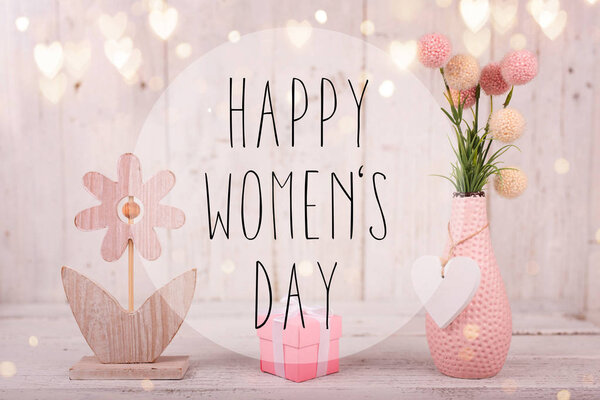 Flowers composition for Womens Day. Pink flowers on old white wooden background.