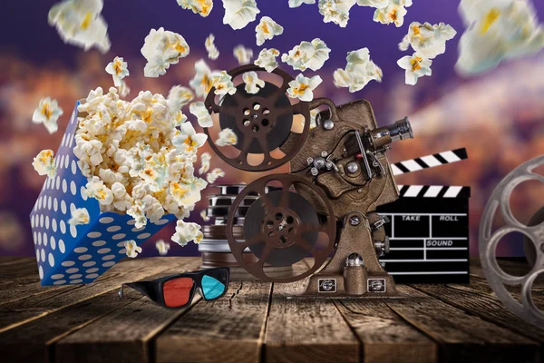 Pop-corn, movie tickets, clapperboard and other things in motion. — Stock Photo, Image