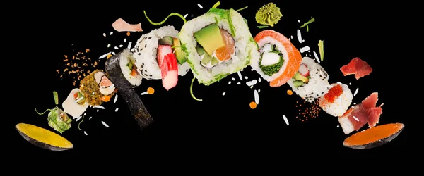 Cijfers van heerlijke Japanse sushi bevroren in de lucht. — Stockfoto