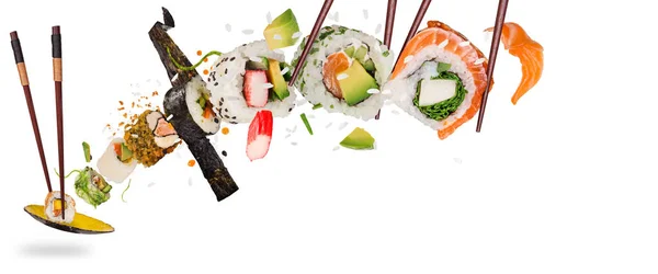 Pieces of delicious japanese sushi frozen in the air. — Stock Photo, Image