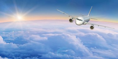 Ticari uçak bulutların üzerinde uçan.