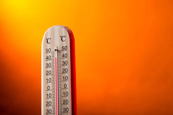 Celsius thermometer with hot background — Stock Photo, Image