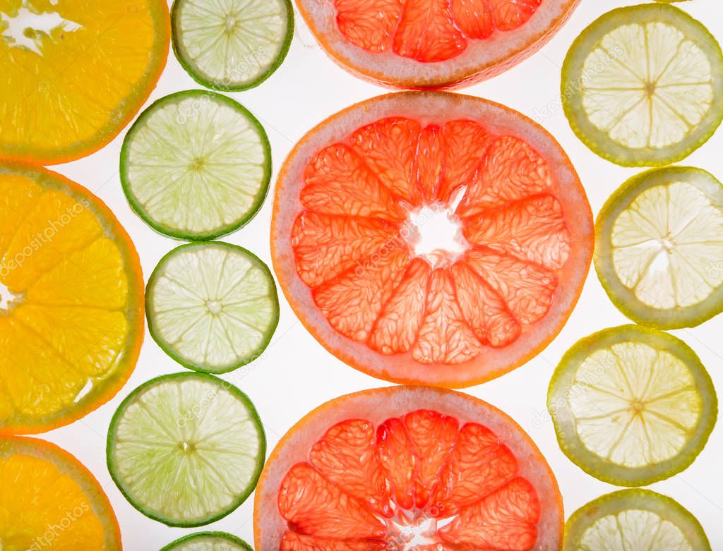 Bright fresh citrus slices, back light transparent fruit.