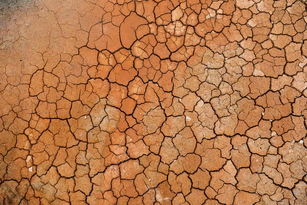 Fondo de textura de suelo agrietado seco marrón . — Foto de Stock