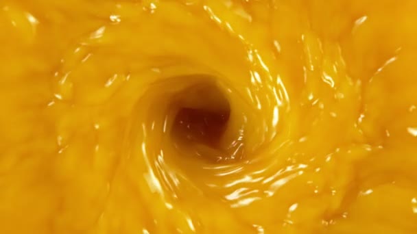 Super slow motion of orange juice vortex. Filmed on high speed cinema camera — Stock Video