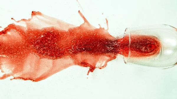 Top Shot of Breaking Glass with Red Wine — Stock Photo, Image