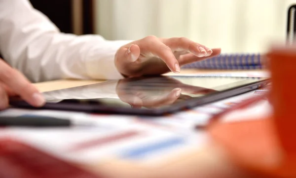 Businesswoman touching tablet with graph — Stock Photo, Image