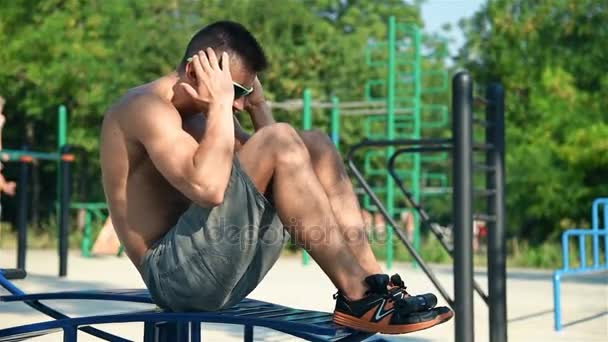 Muscular Man Swinging Press In Playground. Slow Motion Effect. Crossfit Concept — Stock Video