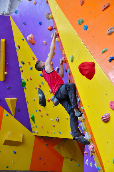 Free Climber Man Climbing On Color Practice Wall Indoors