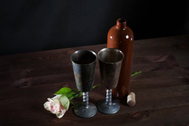two vintage Cup, a bottle of wine and rose, still life clipart