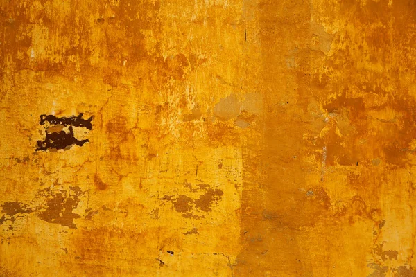 De textuur van de betonnen muren zijn geschilderd in oranje-geel — Stockfoto
