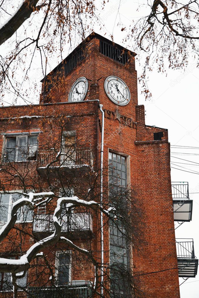 The building with a clock in the historic center of the city on Lenin Square