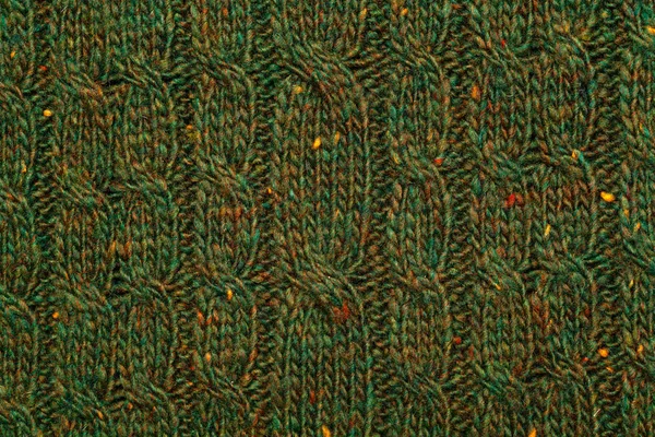Strickstoff-Textur. grüne gestrickte strukturierte Hintergrund mit einem Muster Nahaufnahme — Stockfoto