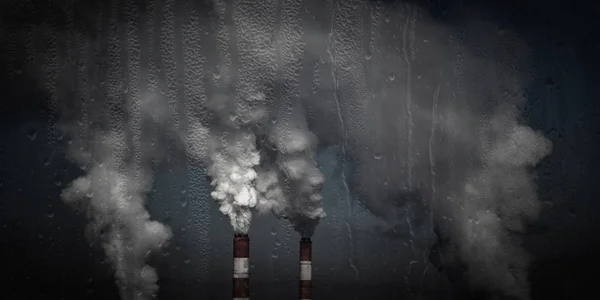 Chimeneas humeantes, humo espeso de tuberías industriales a través del vidrio bajo la lluvia —  Fotos de Stock