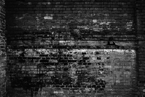Rough brick wall, black and white photo. Grunge background