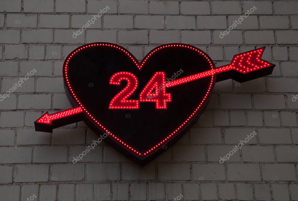 Illumination sex shop - a symbolic heart pierced by an arrow, 24 hours a day. Products for adults