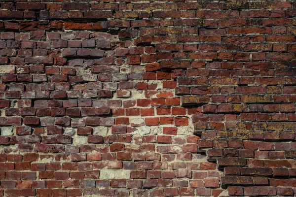 Stary mur z cegieł po cenach dumpingowych. Tło, Cegła o fakturze czerwony. Styl Vintage. Miejsca. Tło dla projektanta. stary mur murarstwo — Zdjęcie stockowe