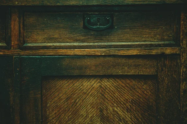 Detail of antique furniture. Background, the texture of a natural wood aged from time