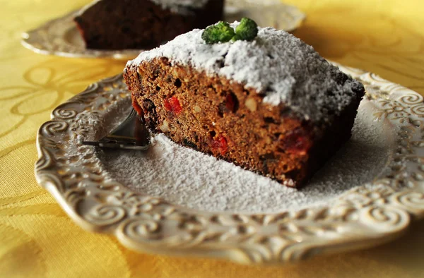 Fruitcake with chocolate and nuts — Stock Photo, Image