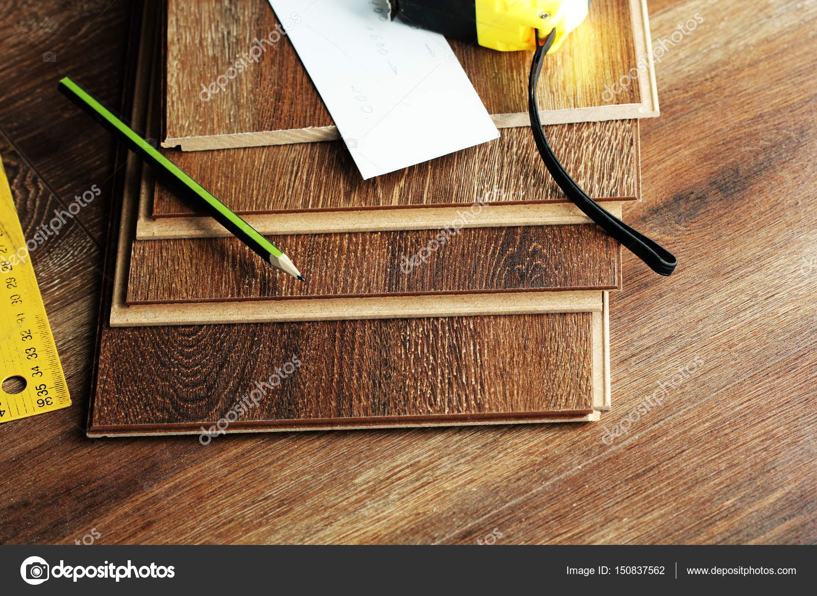 Laminate Floor Planks And Tools On Wooden Background Stock Photo Laminate Floor Planks And Tools On Wooden Background Stock Photo