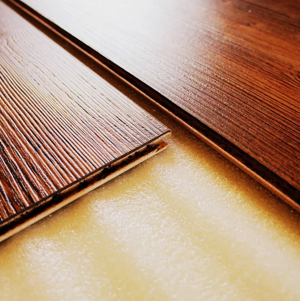 Brown laminate floor planks intalling , close up — Stock Photo, Image