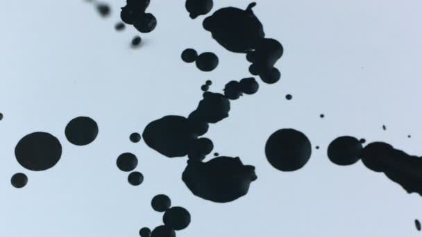 Slow motion black blobs of paint — Stock Video
