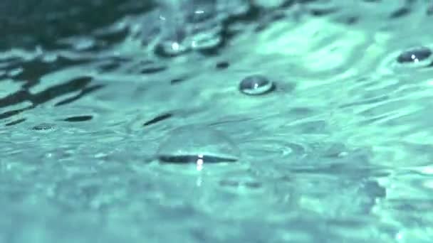 Slow motion bubble floating on water surface — Stock Video