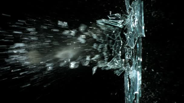 Slow motion destroying sheet of glass — Stock Video