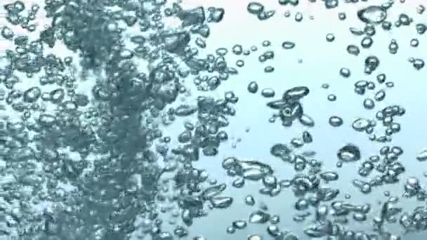 zpomaleně protékající bubliny ve vodě