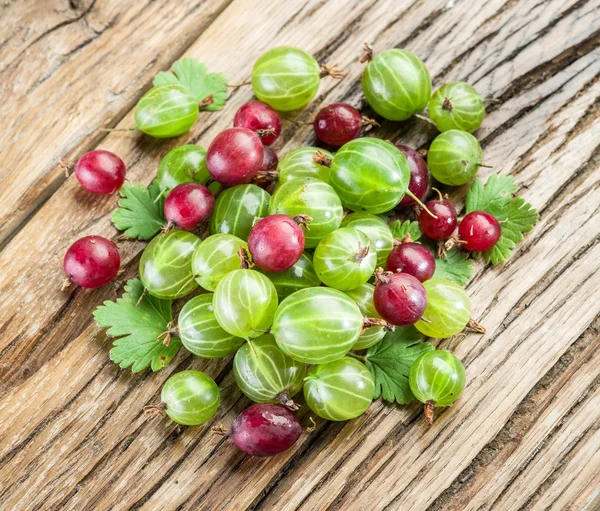 Gooseberries on the wooden table. — Stock Photo, Image