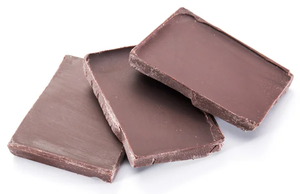 Pedaços de barra de chocolate isolado em um fundo branco. — Fotografia de Stock