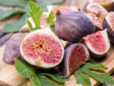 Ripe fig fruits on the wooden table. clipart